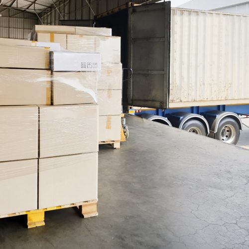 stack-shipment-boxes-pallet-waiting-load-into-container-truck-road-freight-shipment-transport-by-truck